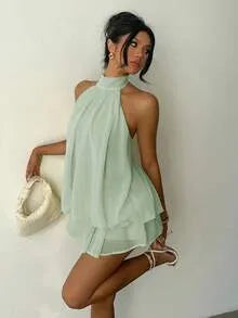 Halter neck tiered ruffle mini dress – white, kneeling pose